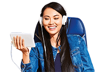 Woman listening to headphone on her mobile device
