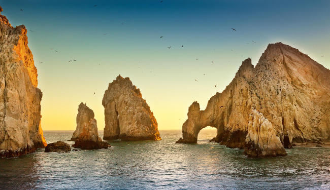 Rock outcroppings protruding out of the ocean.